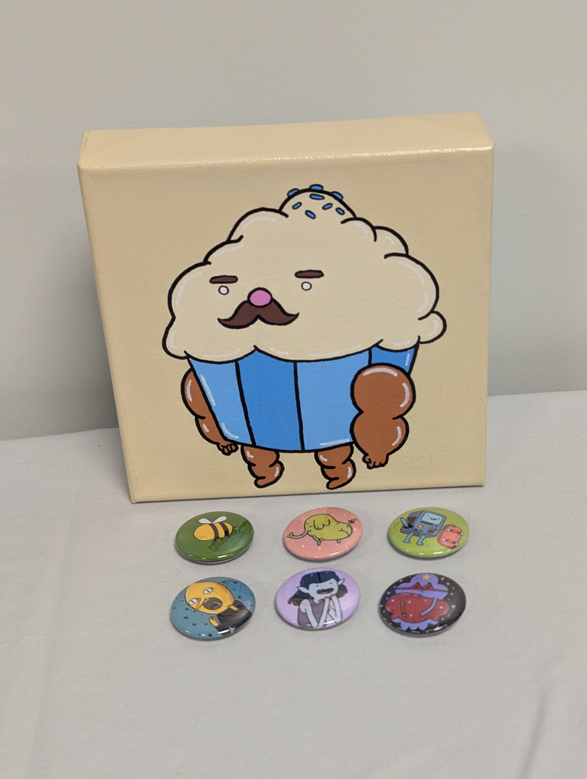 055 - Mr Cupcake Canvas Painting 6”x6” & 6 1.25" Adventure Time buttons